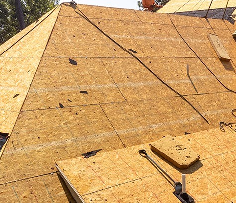 checking roof decking during roof inspection during Westwood